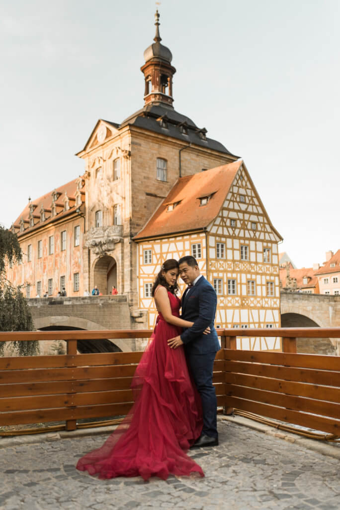 Asian Couple in Bamberg for prewedding shoot with view at the old town hall of Bamberg